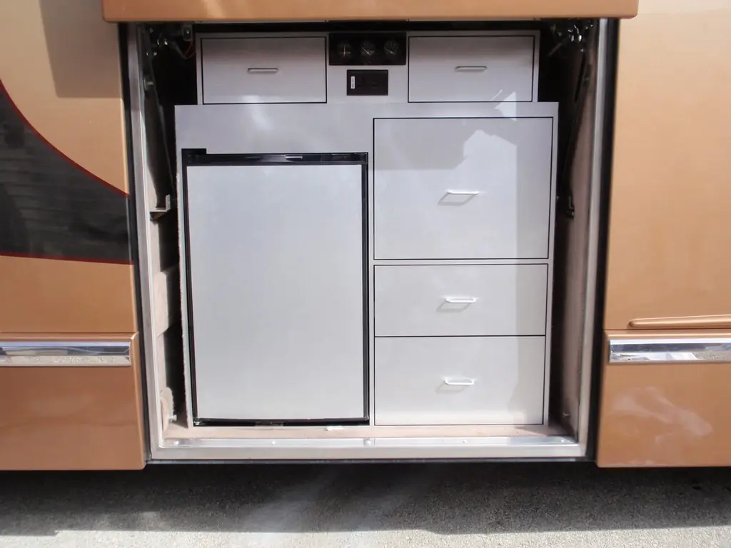 Prevost H3-45 exterior bay cabinet with slide-out barbecue built by Excalibur Coach