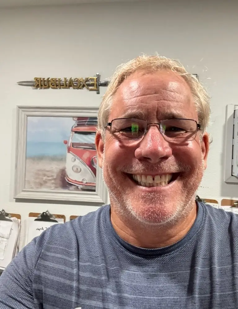 Doug Stolfo, owner of Excalibur Coach, in the Sanford office