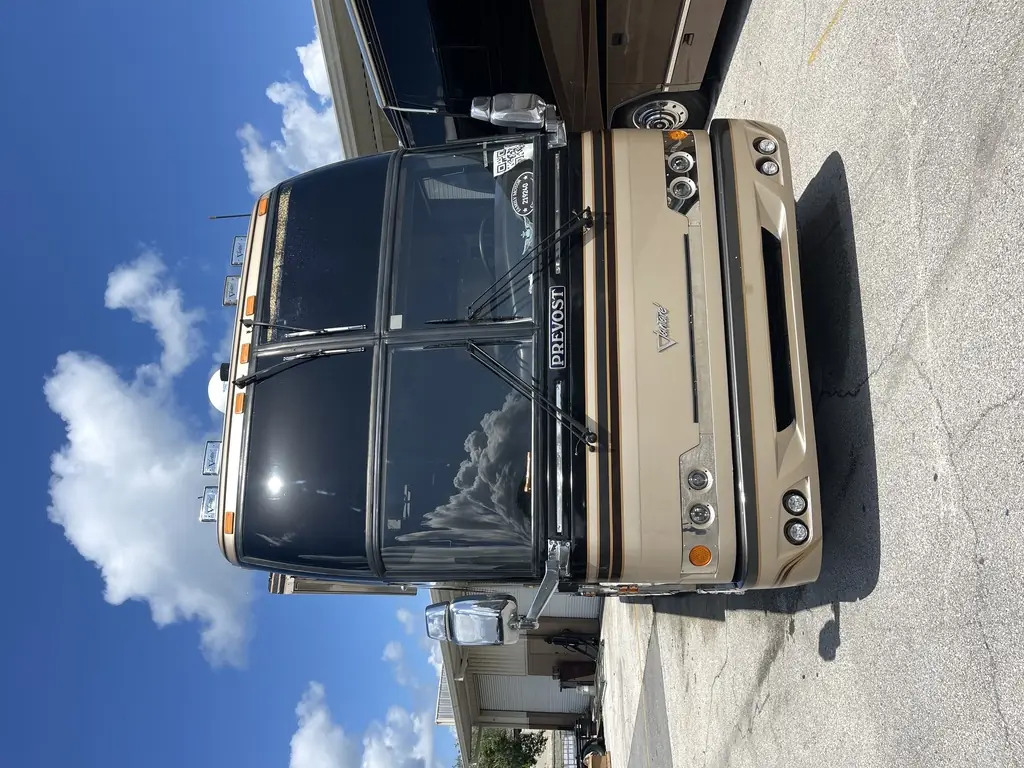 Prevost H3-45 headlight assemblies being worked on at Excalibur Coach