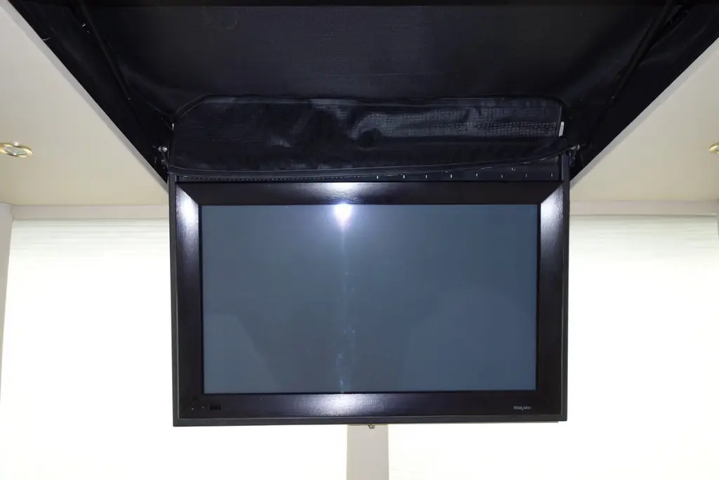 Prevost Marathon XL salon before a new HD television installation by Excalibur Coach