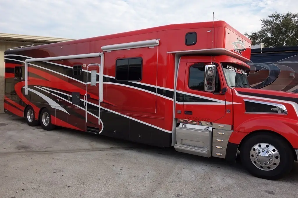 Red Showhauler motorhome before new Girard awnings were added by Excalibur Coach