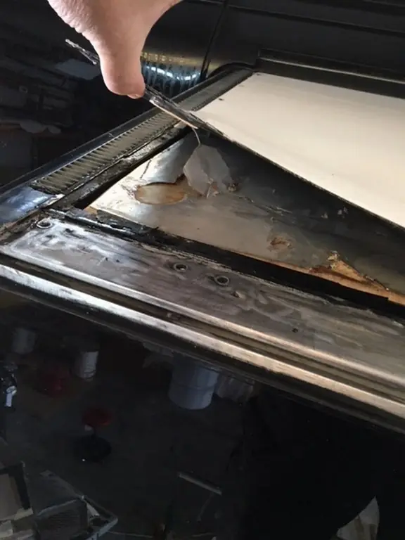 New roof metal sealed and refitted to the salon slide