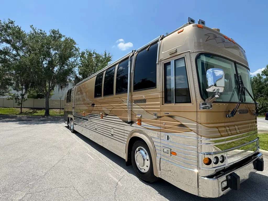 Front three-quarter view of the 1999 Vogue Prevost XL offered for sale by Excalibur Coach