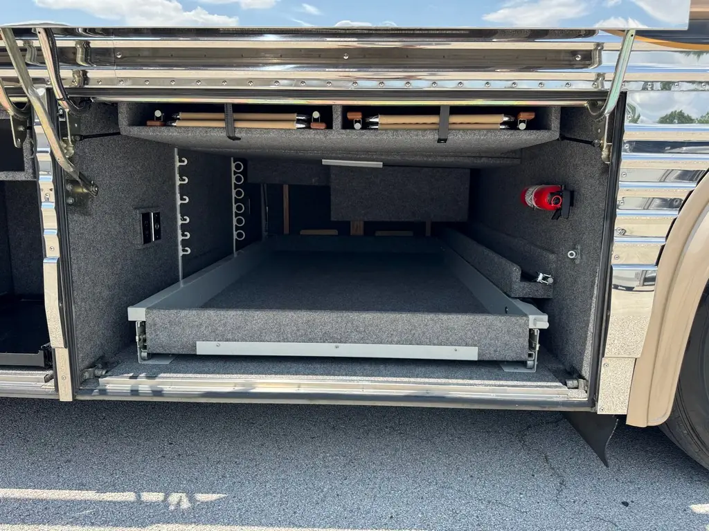 Storage bay with slide-out tray on the 1999 Vogue Prevost XL