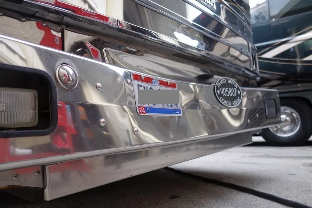 Prevost XL Royale with front bumper collision damage before Excalibur Coach repairs